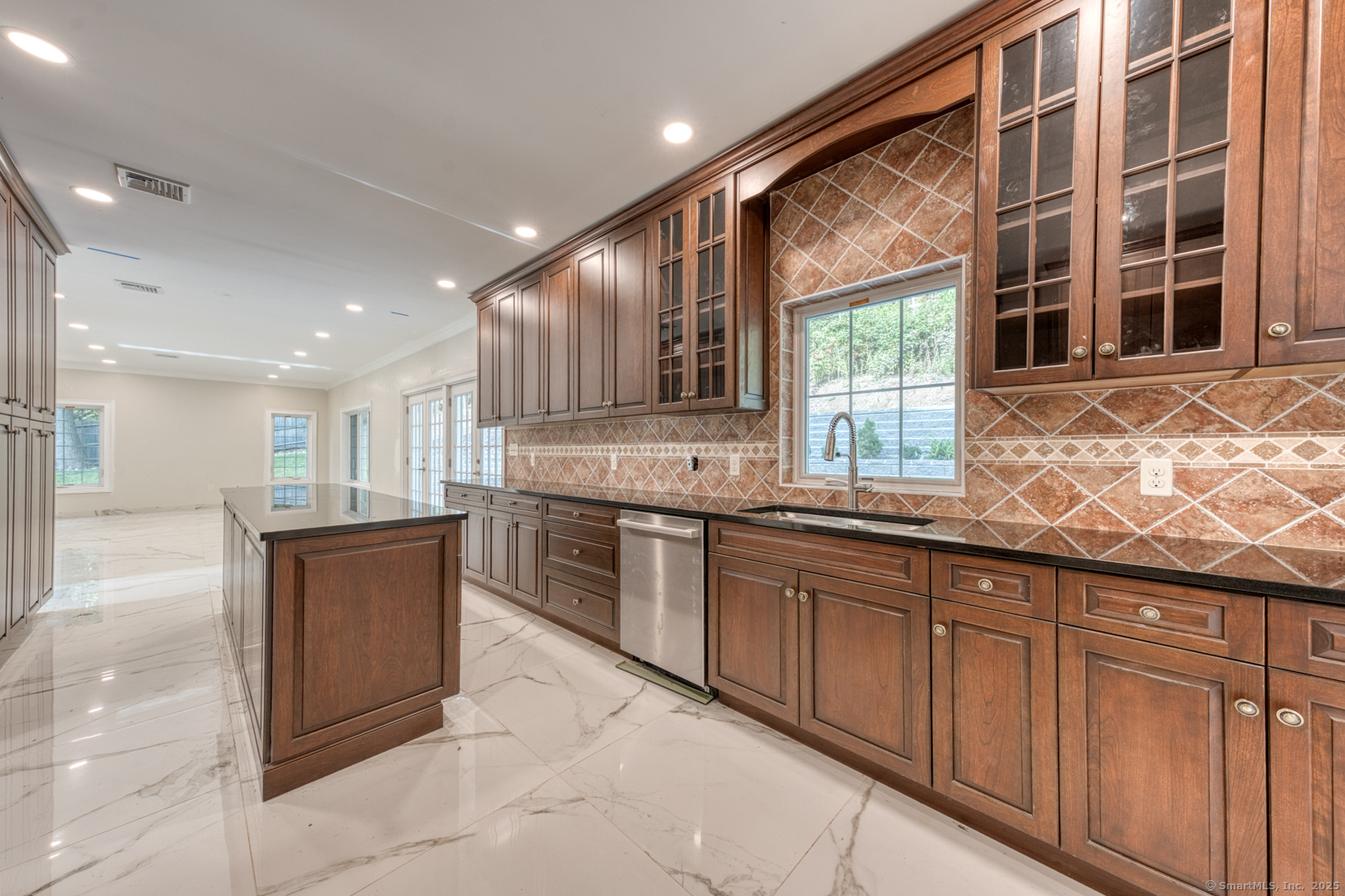 171 Oregon Road Meriden, CT 06451 - Photo 17 of 38 a large kitchen with kitchen island granite countertop a large window and a counter space