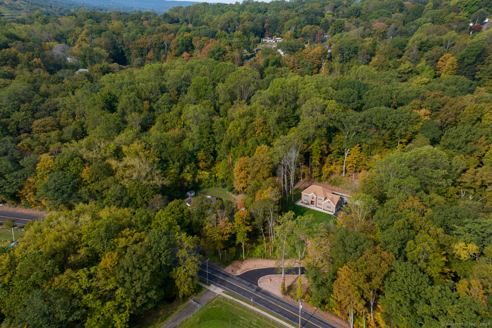 171 Oregon Road Meriden, CT 06451 - Photo 4 of 38 an aerial view of a house with a yard