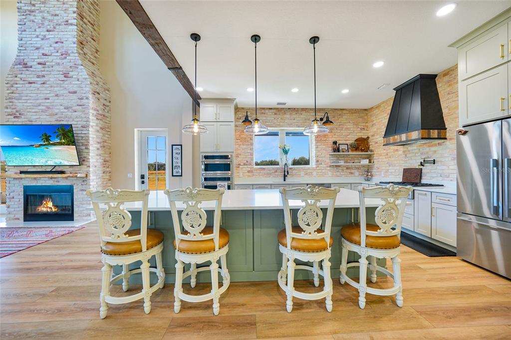 3321 Southwest Martin Lane Arcadia, FL 34266 - Photo 14 of 81 a dining table with chairs and kitchen view