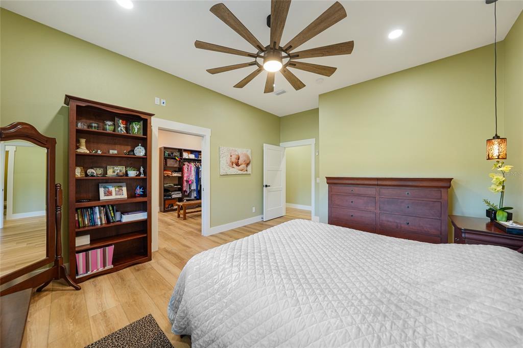 3321 Southwest Martin Lane Arcadia, FL 34266 - Photo 23 of 81 a bedroom with a bed and a book shelf