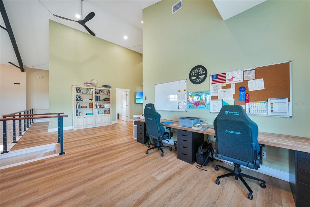3321 Southwest Martin Lane Arcadia, FL 34266 - Photo 37 of 81 a view of a workspace with furniture and wooden floor