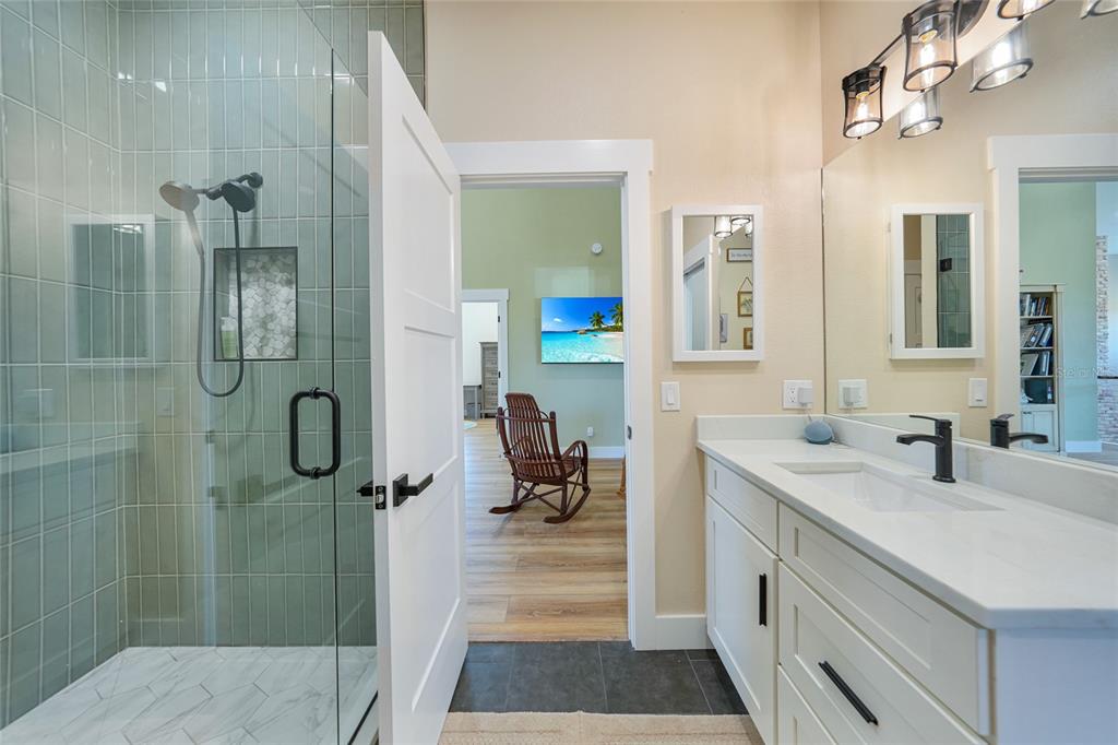 3321 Southwest Martin Lane Arcadia, FL 34266 - Photo 43 of 81 a bathroom with a double vanity sink a toilet and shower