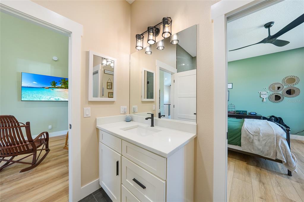 3321 Southwest Martin Lane Arcadia, FL 34266 - Photo 44 of 81 a en suite bathroom with a sink double vanity and a mirror