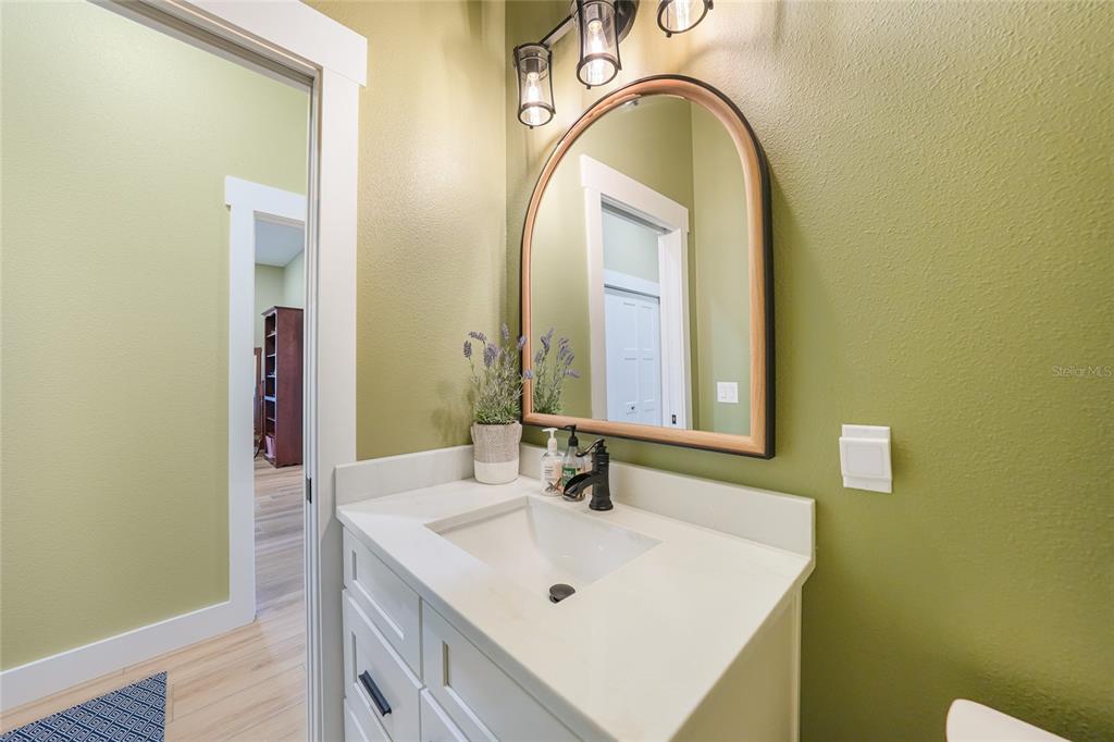 3321 Southwest Martin Lane Arcadia, FL 34266 - Photo 52 of 81 a bathroom with a sink and a mirror