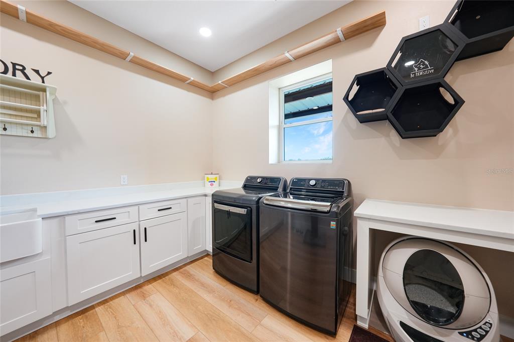 3321 Southwest Martin Lane Arcadia, FL 34266 - Photo 53 of 81 a utility room with sink dryer and washer