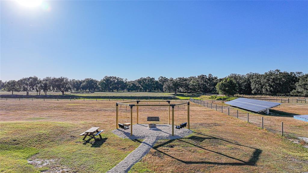 3321 Southwest Martin Lane Arcadia, FL 34266 - Photo 71 of 81 a view of a lake with couches and wooden floor