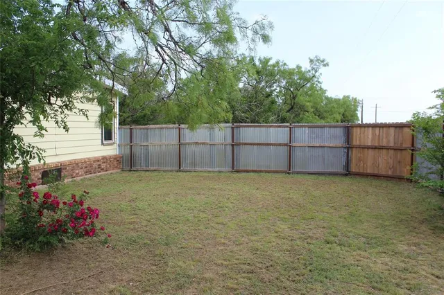 a view of backyard and garden