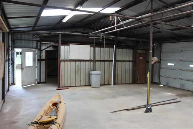 a view of a hallway with wooden walls