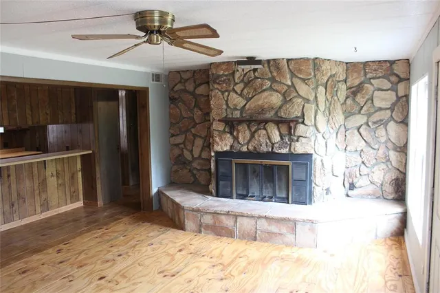 a view of a livingroom with a fireplace and furniture