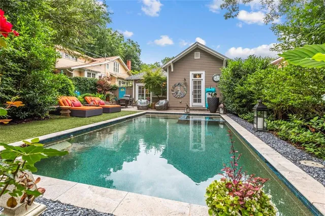 a view of swimming pool with a patio