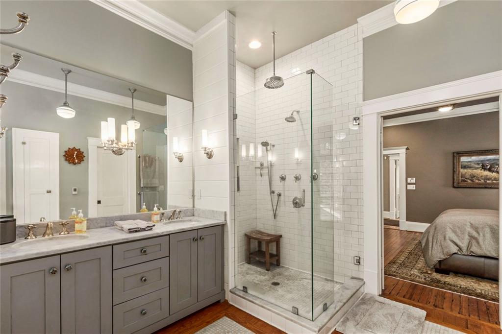 976 Adair Avenue Northeast Atlanta, GA 30306 - Photo 21 of 38 a bathroom with a shower sink and mirror