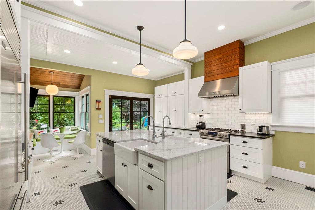 976 Adair Avenue Northeast Atlanta, GA 30306 - Photo 25 of 38 a kitchen with a sink stove and wooden floor