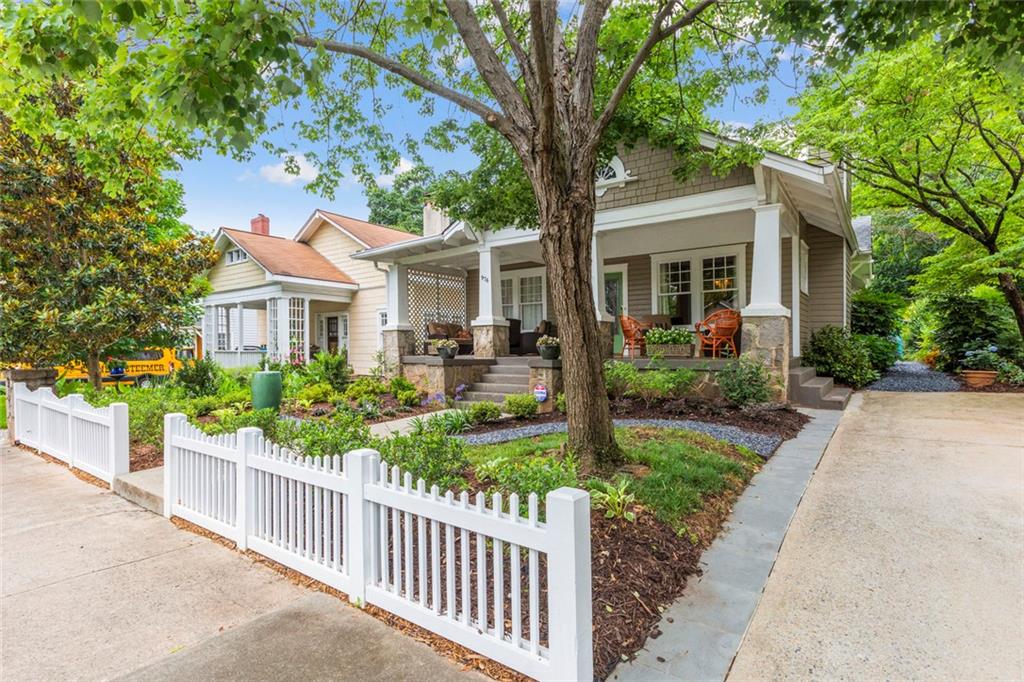 976 Adair Avenue Northeast Atlanta, GA 30306 - Photo 4 of 38 a front view of a house with a yard