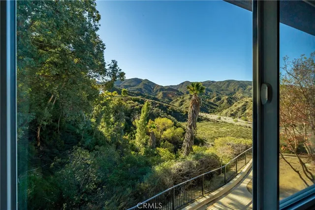 a view of a yard from a balcony