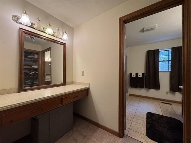 43 West Meadow Road, Unit 43 Haverhill, MA 01832 - Photo 33 of 42 a en suite bathroom with a sink and a large mirror