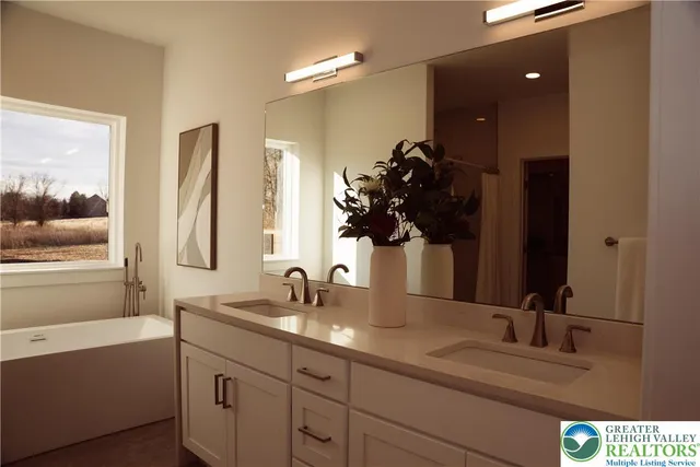 a bathroom with a double vanity sink and a mirror