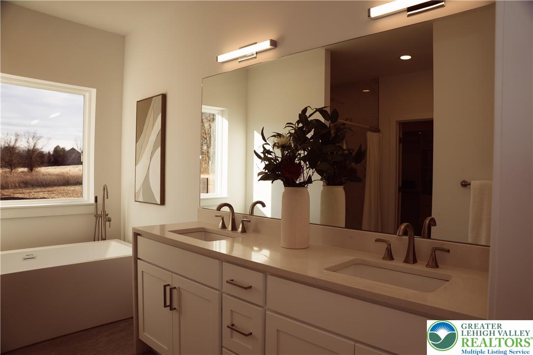 3102 Moyer Road Hellertown, PA 18055 - Photo 12 of 35 a bathroom with a double vanity sink and a mirror