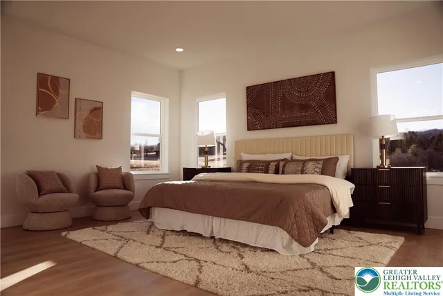 a bedroom with a bed and couch