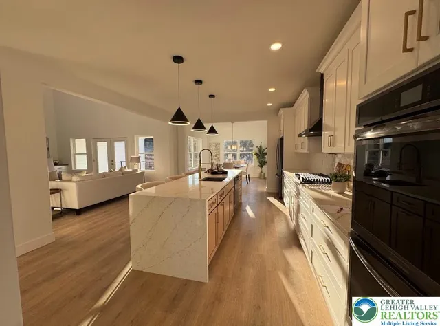 a large kitchen with stainless steel appliances