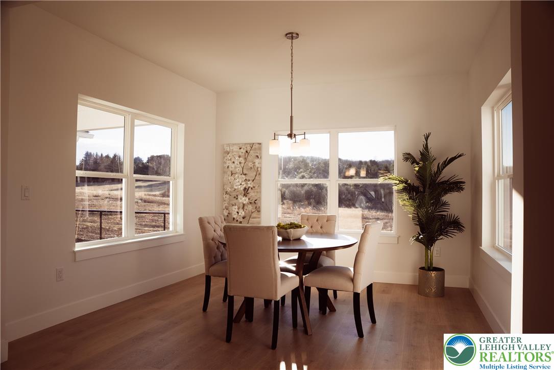 3102 Moyer Road Hellertown, PA 18055 - Photo 7 of 35 a view of a dining room with furniture window and wooden floor