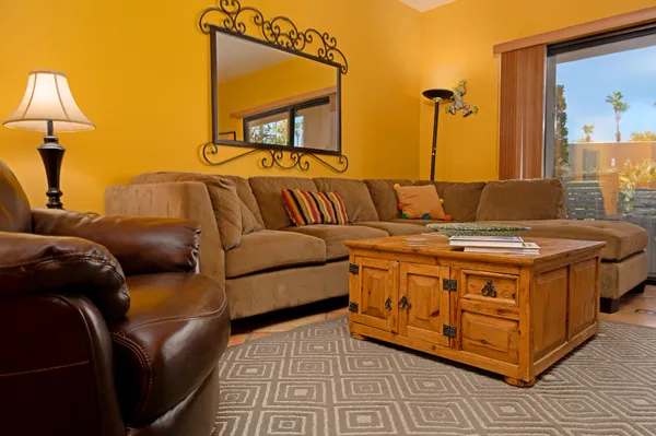 a living room with furniture and a table