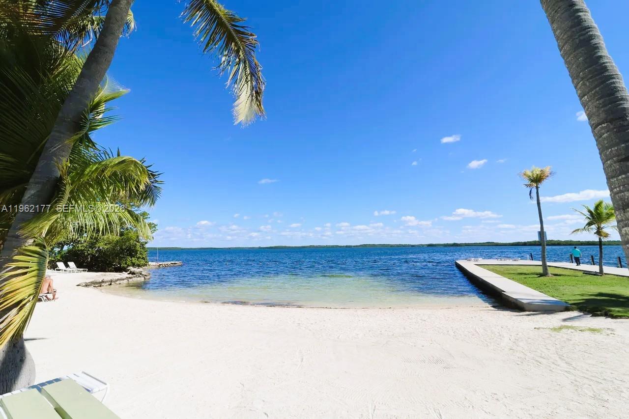 29 Bass Avenue Key Largo, FL 33037 - Photo 14 of 38 a view of a swimming pool with a yard