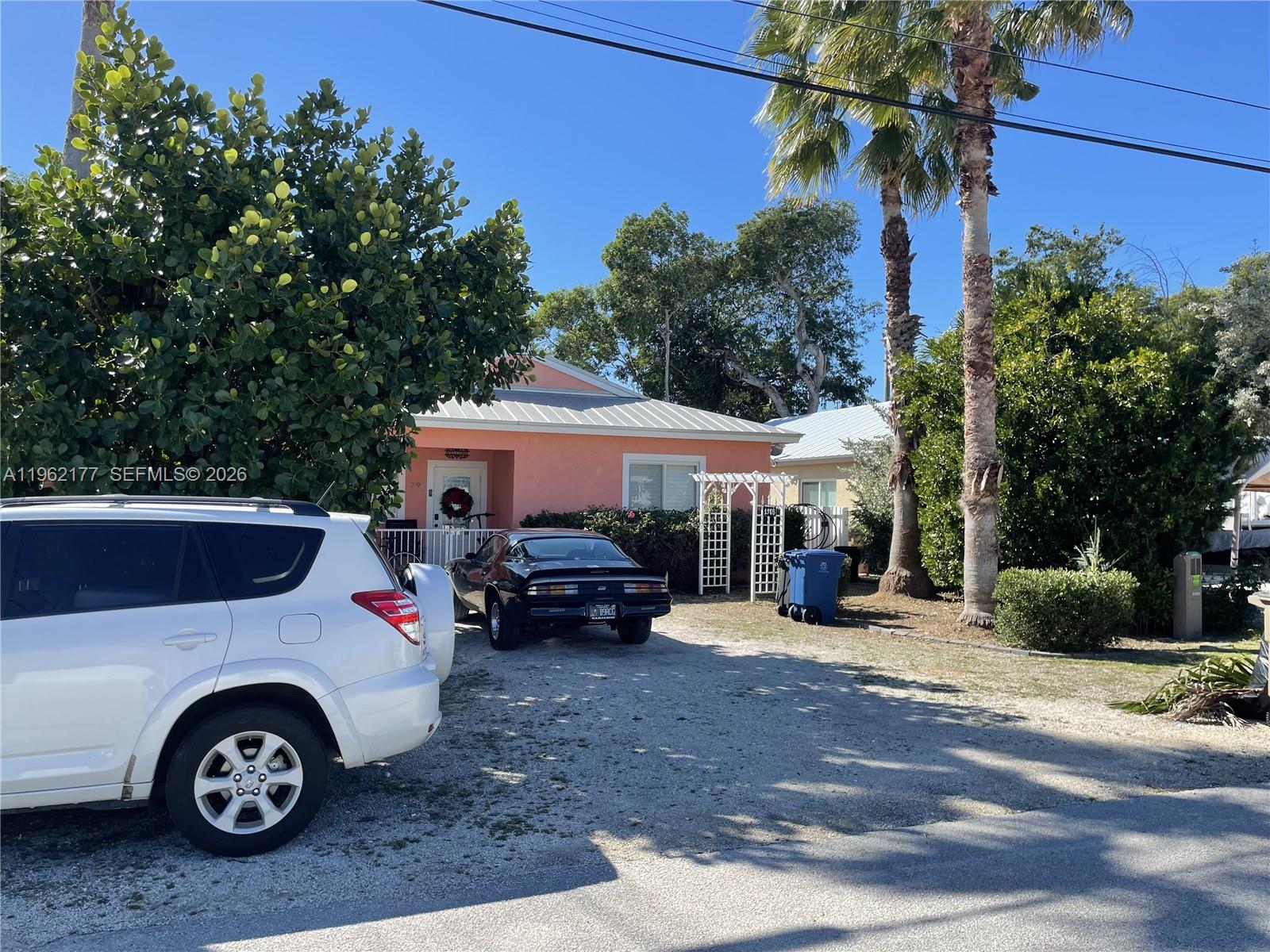 29 Bass Avenue Key Largo, FL 33037 - Photo 4 of 38 a view of a car in front of a house