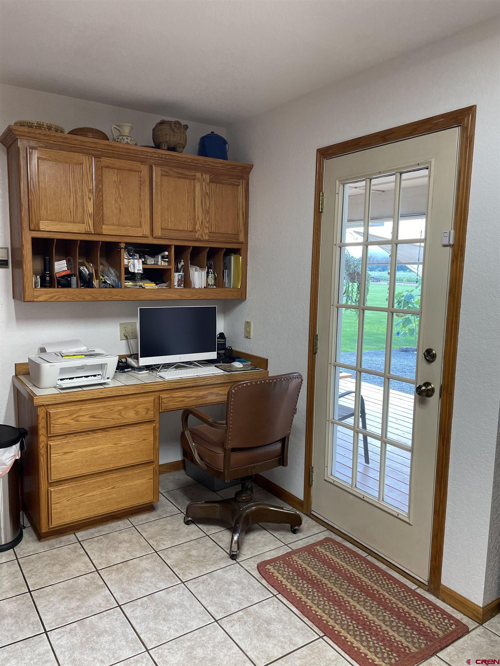 14755 6215th Road Montrose, CO 81403 - Photo 12 of 34 a living room with furniture a rug and a window