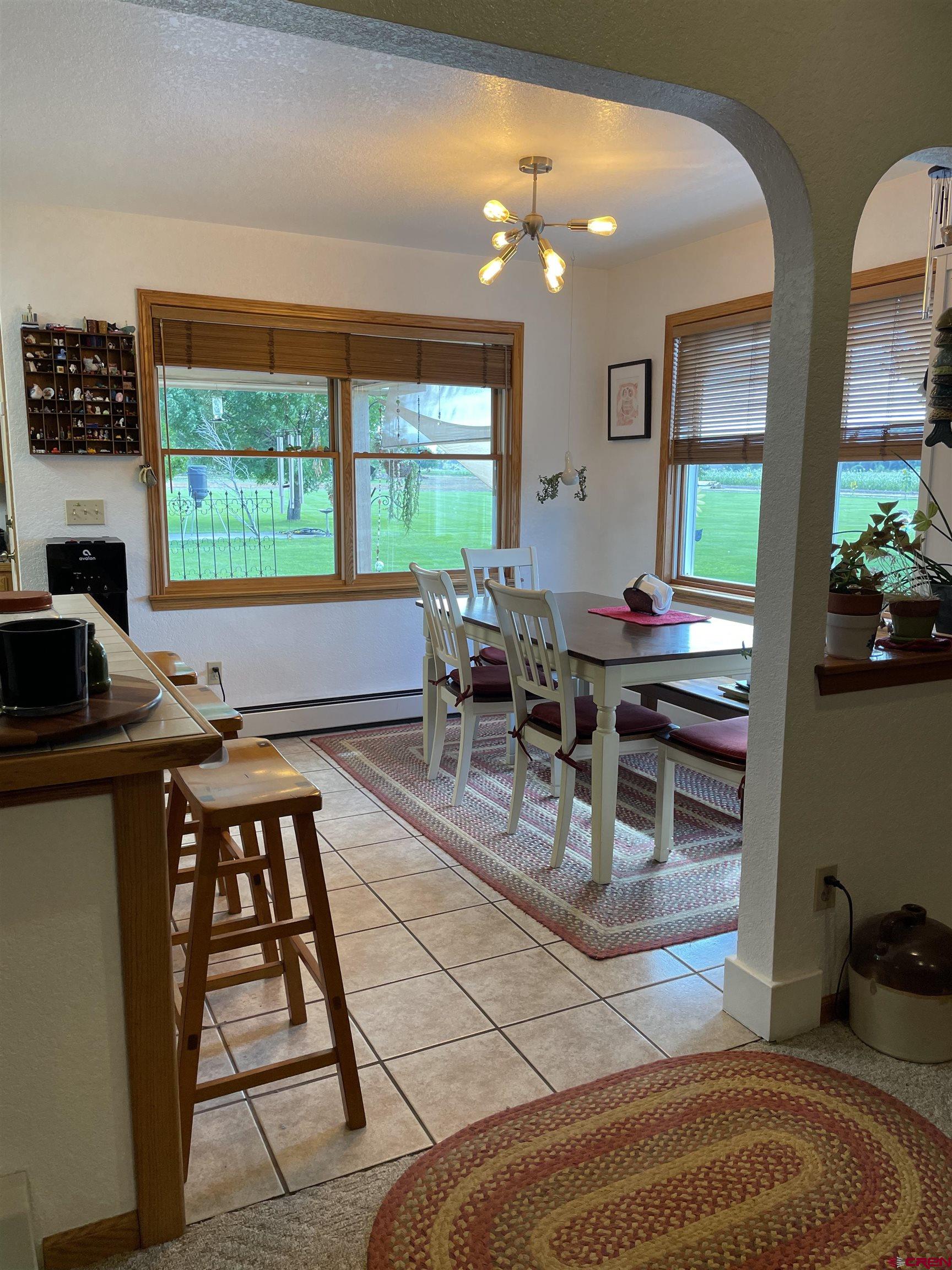 14755 6215th Road Montrose, CO 81403 - Photo 13 of 34 a work room with furniture and a large window