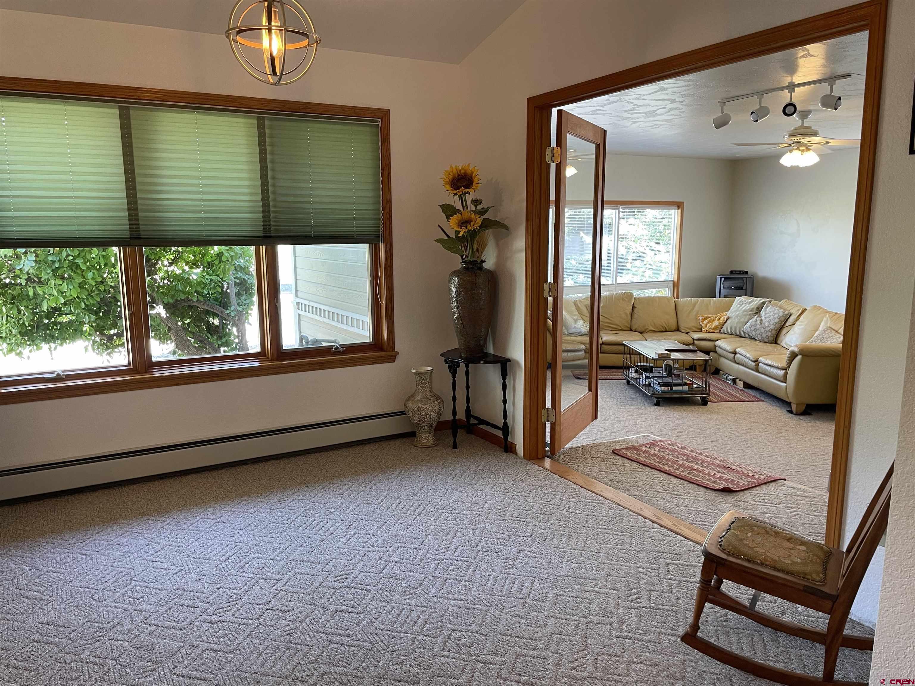 14755 6215th Road Montrose, CO 81403 - Photo 15 of 34 a living room with furniture and a window