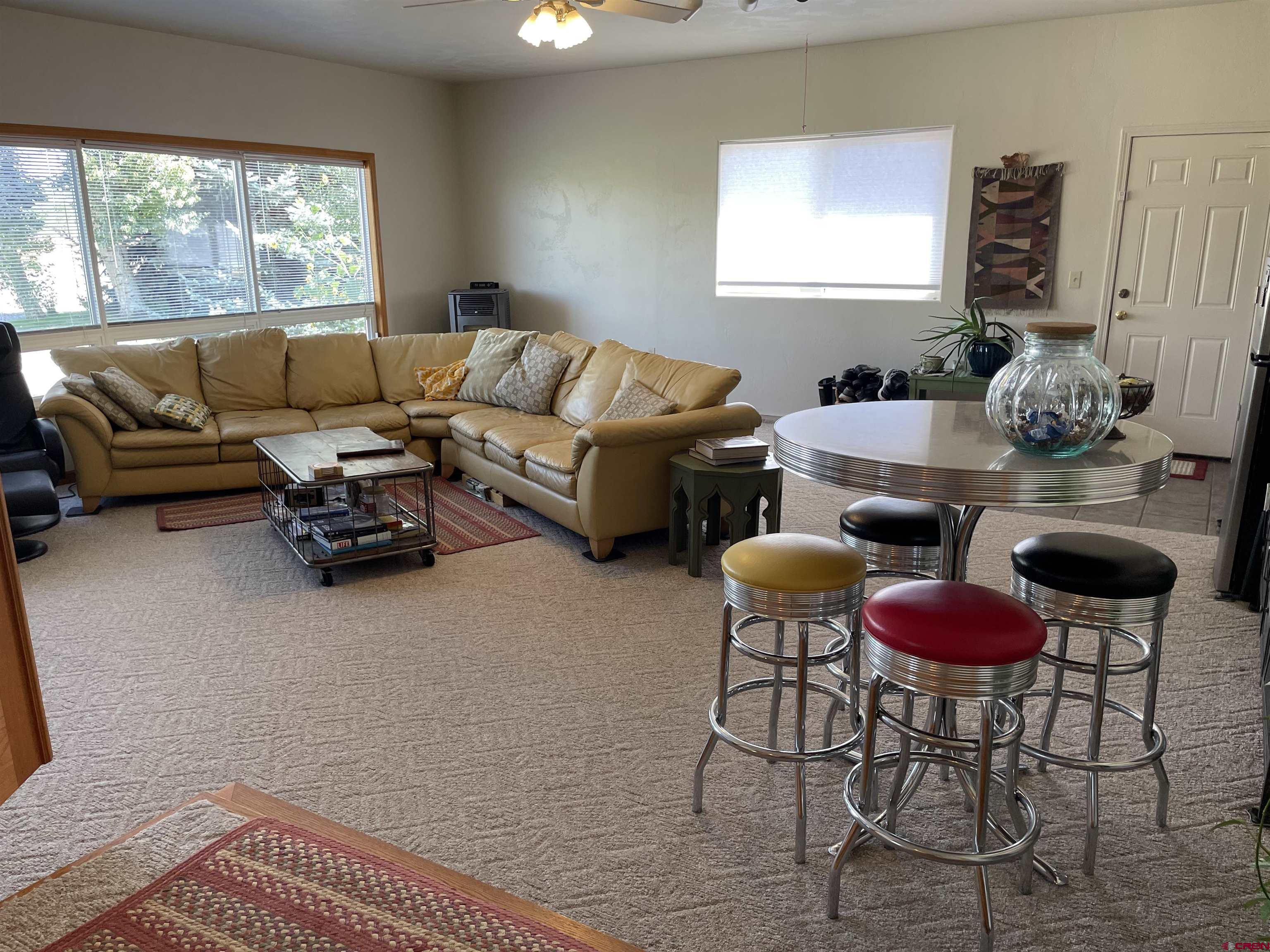 14755 6215th Road Montrose, CO 81403 - Photo 17 of 34 a living room with furniture and a window