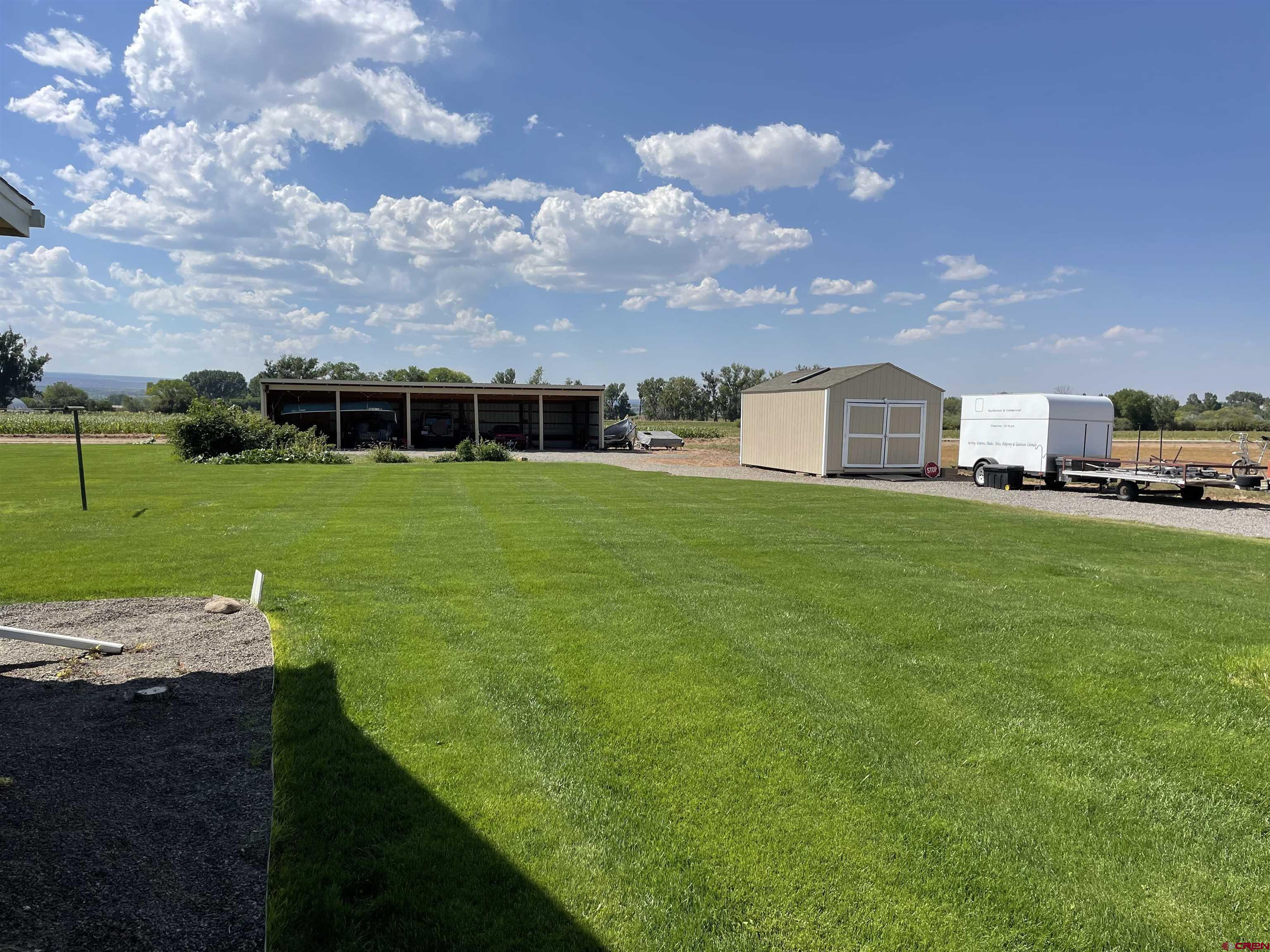 14755 6215th Road Montrose, CO 81403 - Photo 31 of 34 a view of a big yard with a house