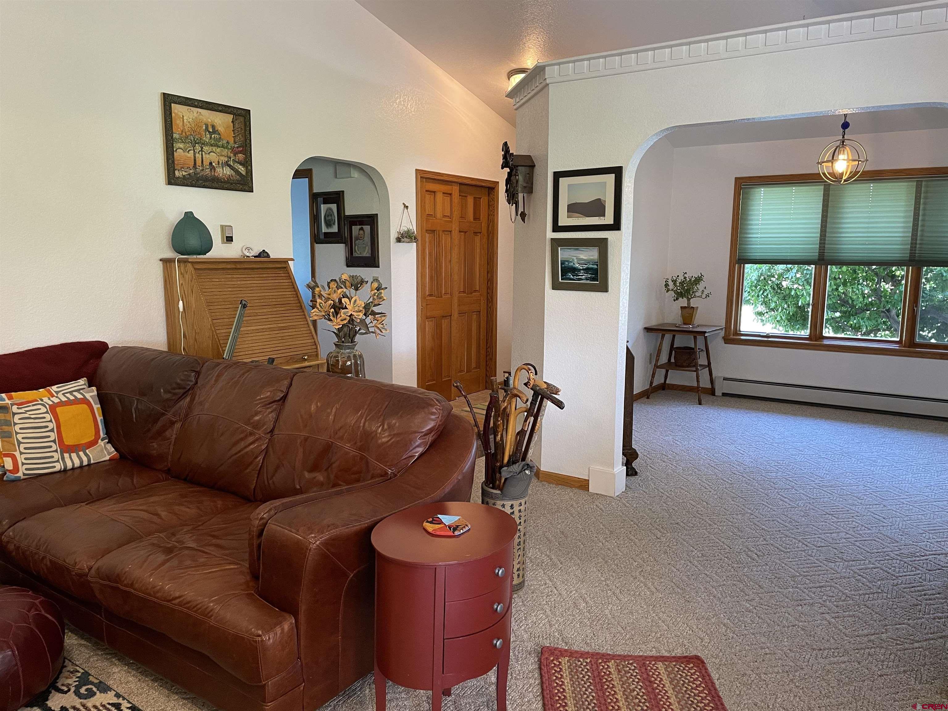 14755 6215th Road Montrose, CO 81403 - Photo 33 of 34 a living room with furniture and a window