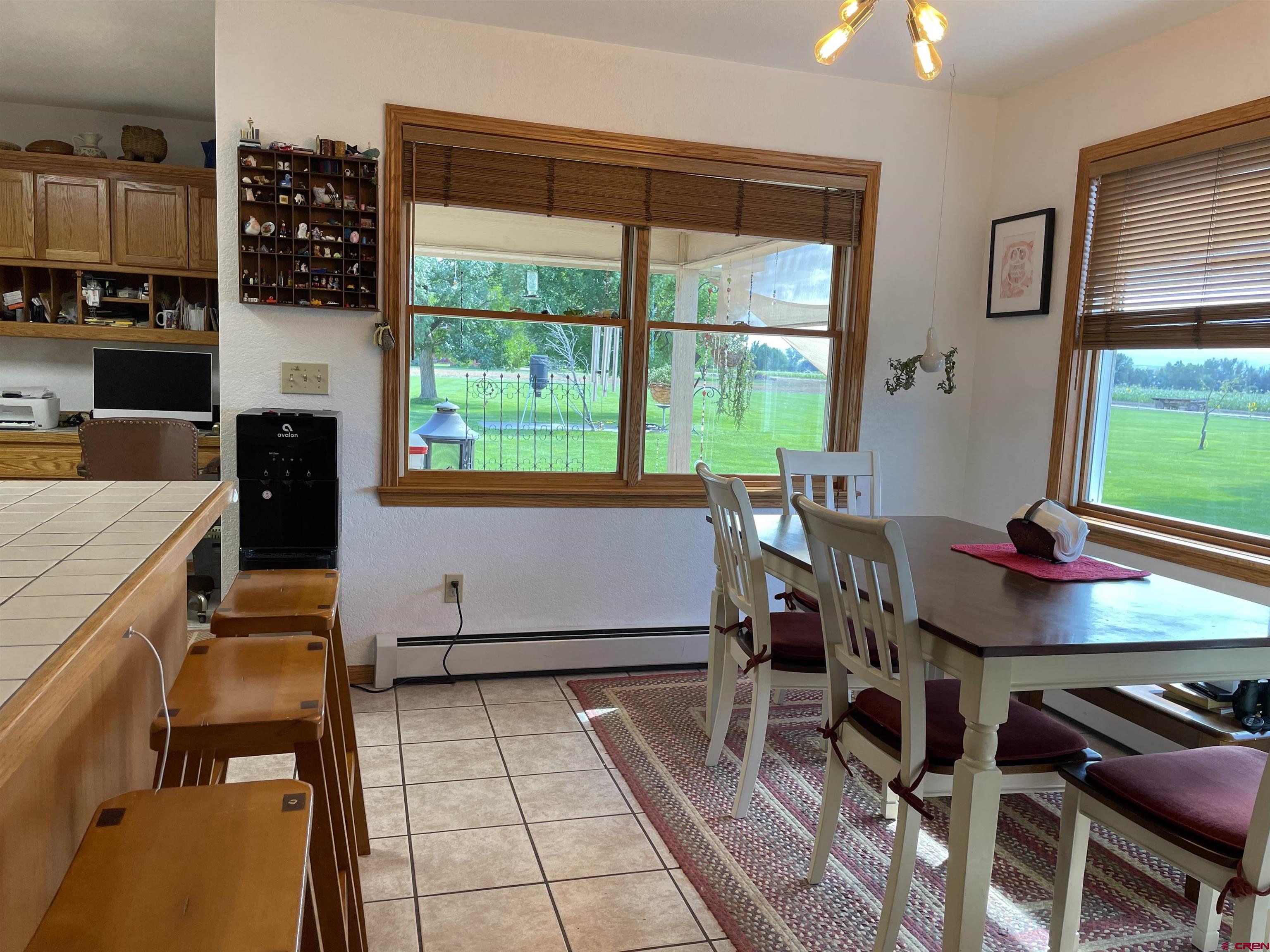 14755 6215th Road Montrose, CO 81403 - Photo 9 of 34 a view of a dining room with furniture window and outside view