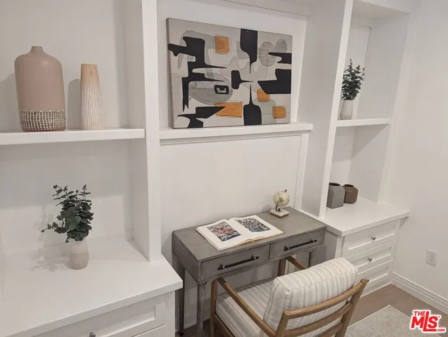 a bathroom with a sink and a potted plant