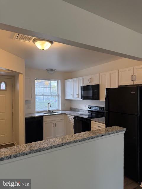 624 Front Street Lititz, PA 17543 - Photo 7 of 23 a kitchen with stainless steel appliances a stove sink microwave and refrigerator