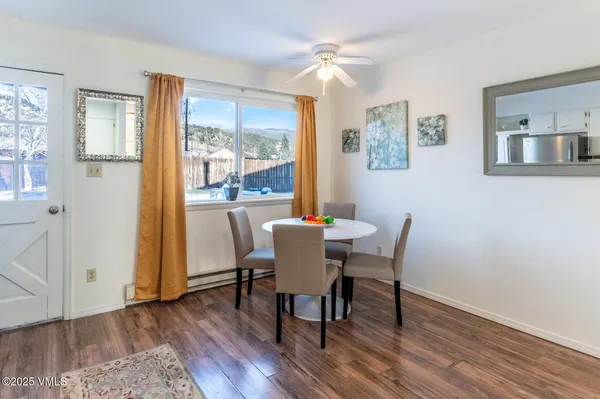 a view of a dining room with furniture window and wooden floor