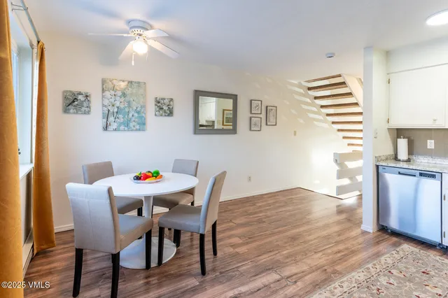 a view of a dining room with furniture and wooden floor