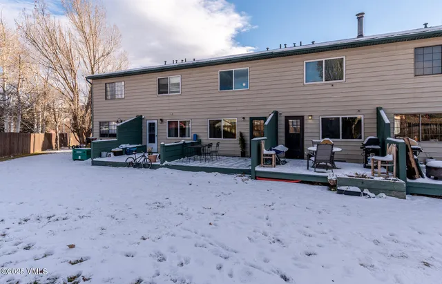 a bedroom with bed couch and window