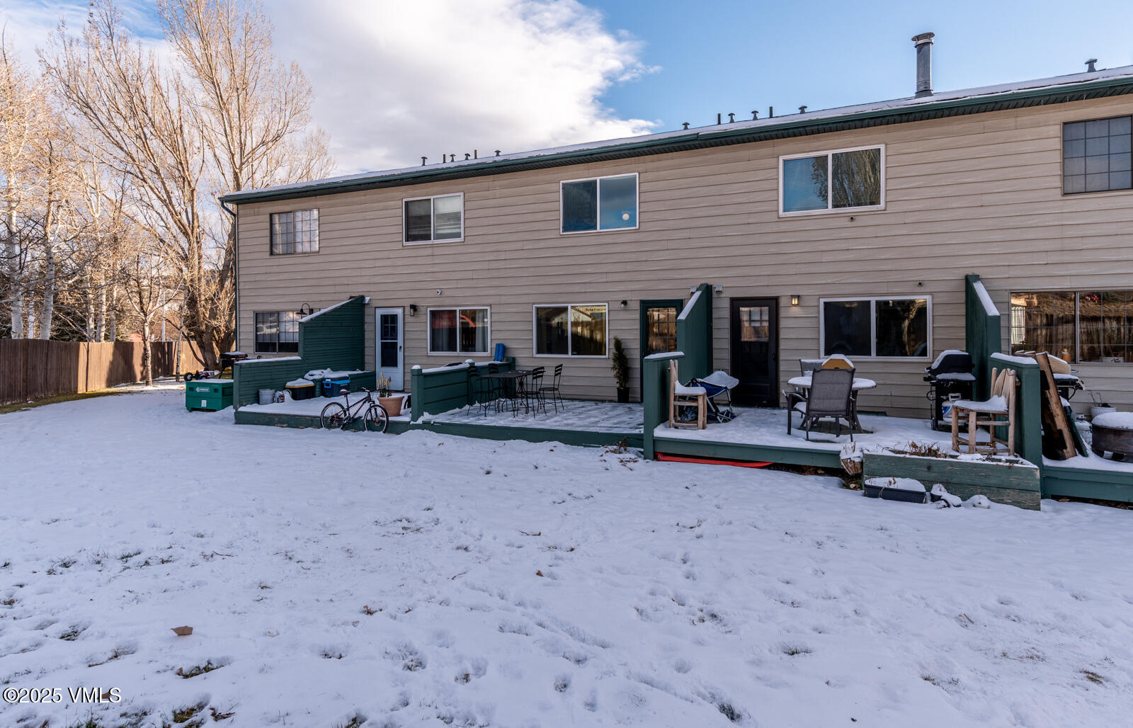 85 Chambers Avenue, Unit 10 Eagle, CO 81631 - Photo 19 of 37 a backyard of a house with fire pit and chairs