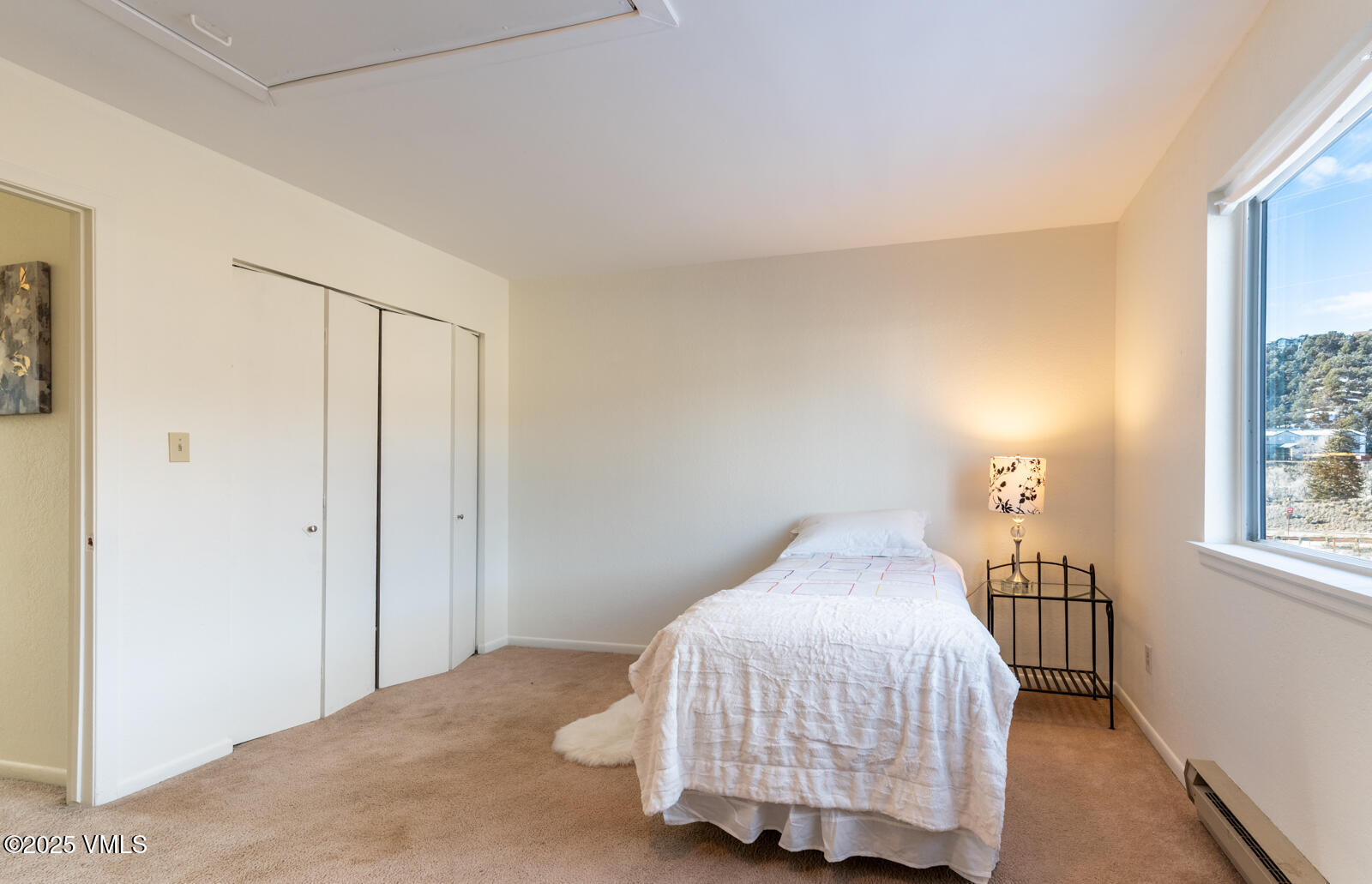 85 Chambers Avenue, Unit 10 Eagle, CO 81631 - Photo 21 of 37 a bedroom with a bed and a window