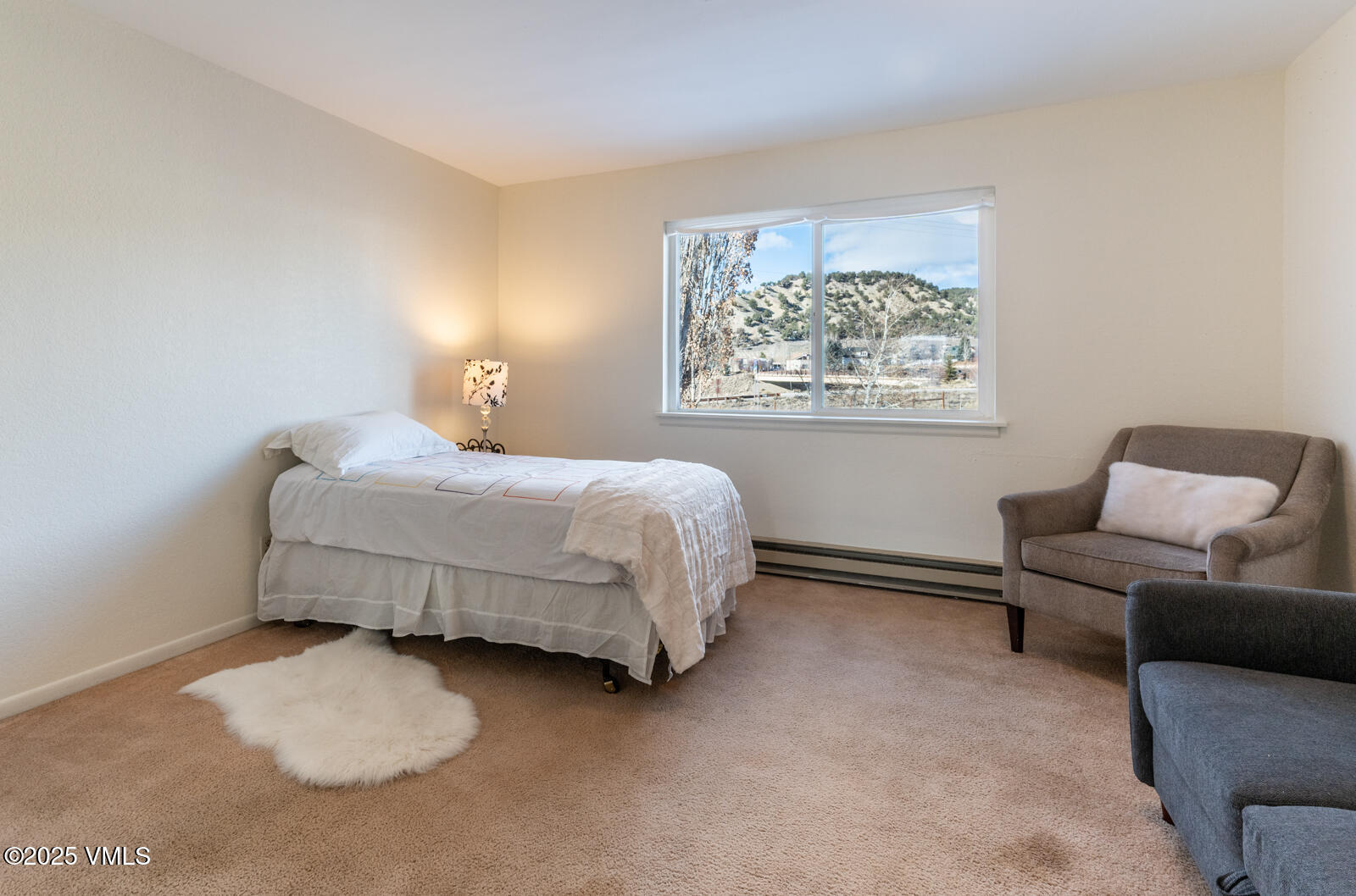 85 Chambers Avenue, Unit 10 Eagle, CO 81631 - Photo 22 of 37 a bedroom with a bed and a couch