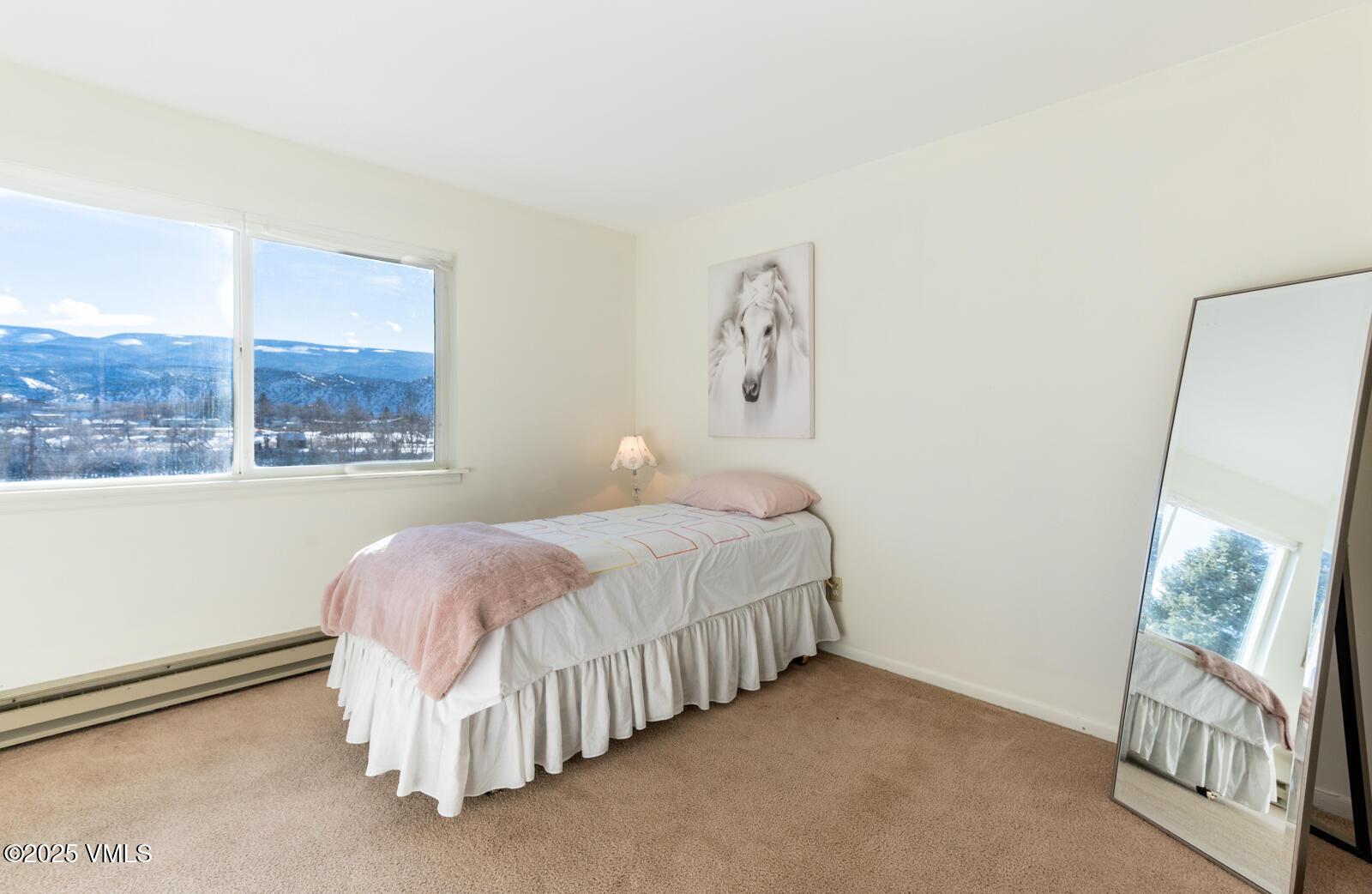 85 Chambers Avenue, Unit 10 Eagle, CO 81631 - Photo 25 of 37 a bedroom with a bed and a window