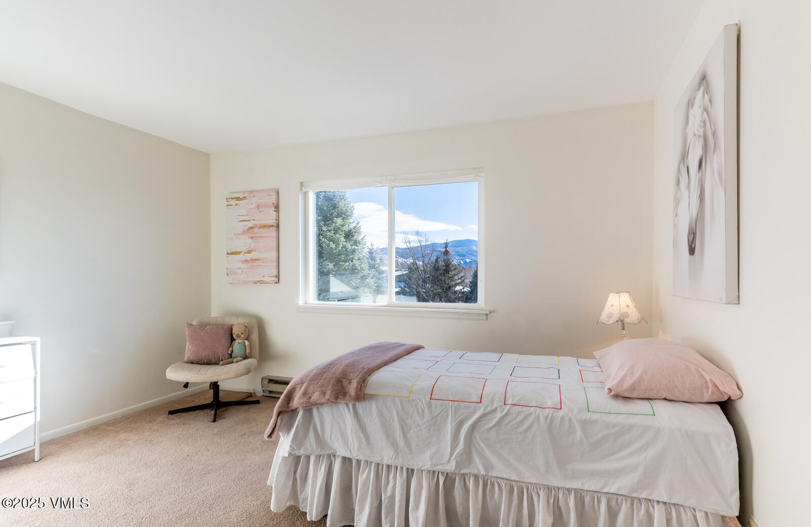 85 Chambers Avenue, Unit 10 Eagle, CO 81631 - Photo 26 of 37 a bedroom with a bed and a window