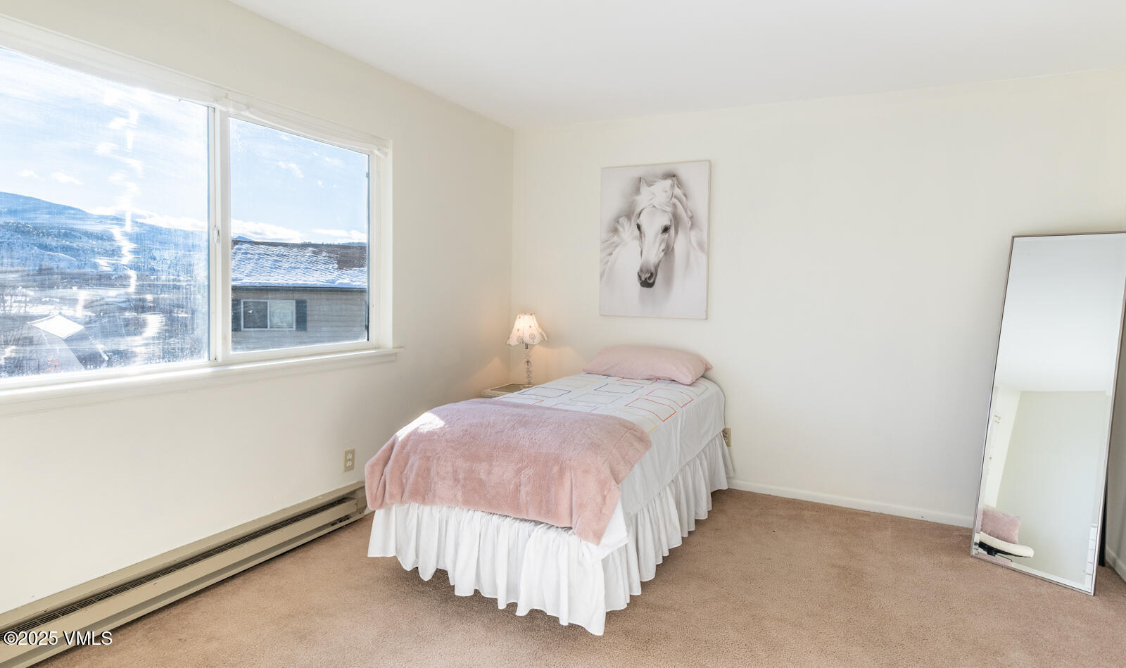 85 Chambers Avenue, Unit 10 Eagle, CO 81631 - Photo 27 of 37 a bedroom with a bed and a window