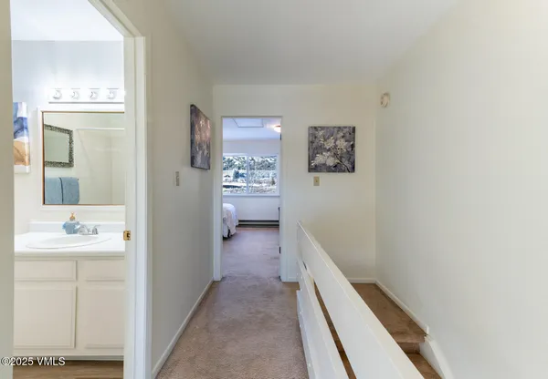 a bedroom with a bed and white walls