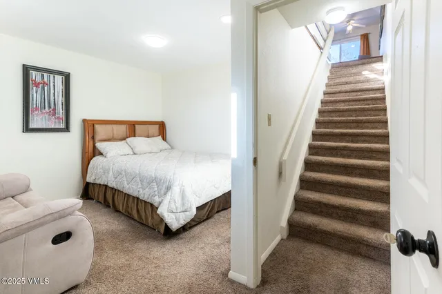 a bedroom with bed and a window