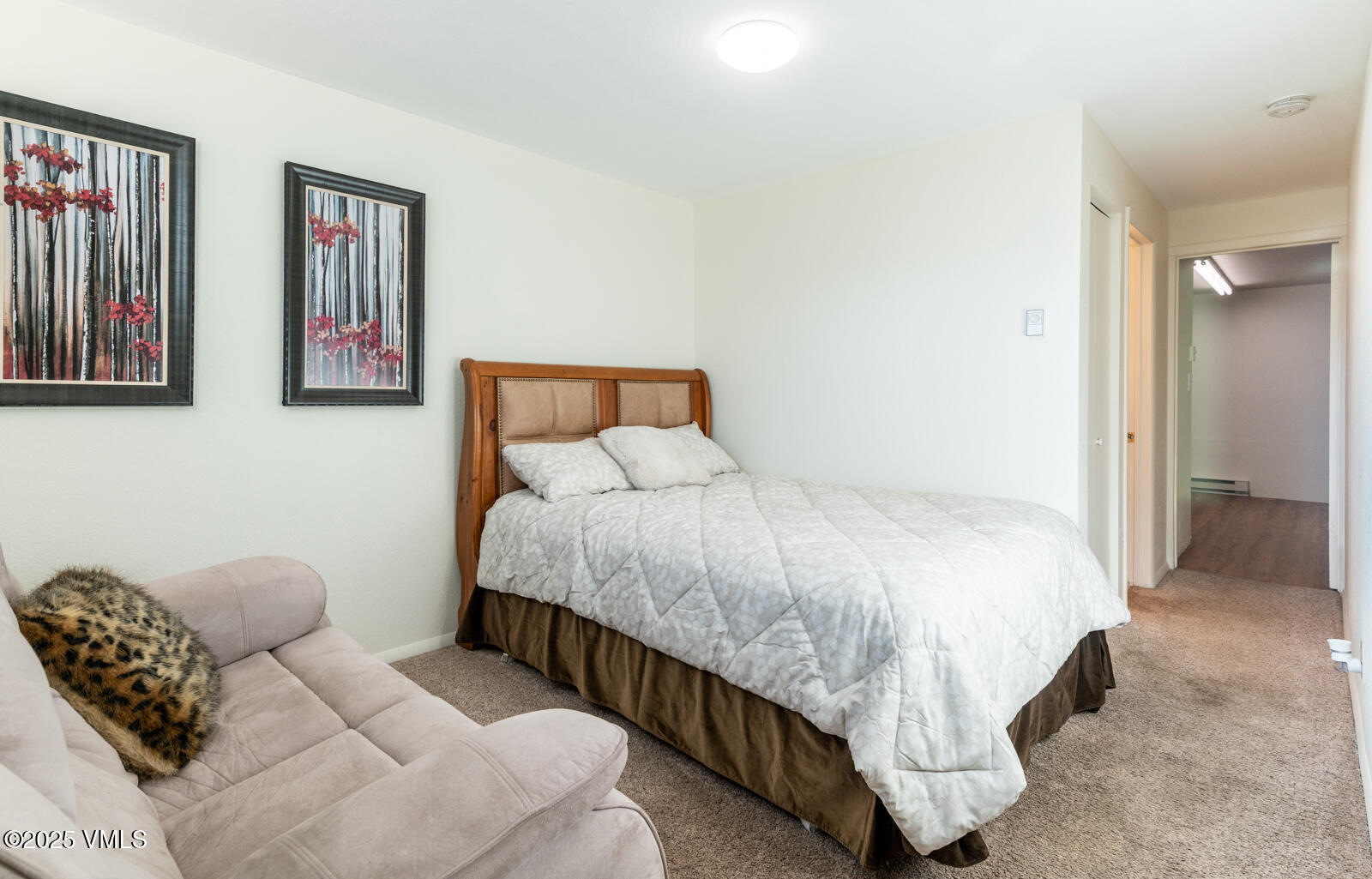 85 Chambers Avenue, Unit 10 Eagle, CO 81631 - Photo 31 of 37 a bedroom with bed and a window