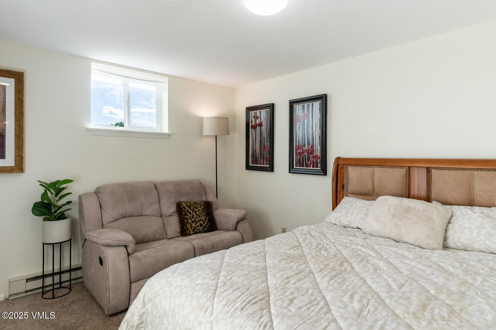 85 Chambers Avenue, Unit 10 Eagle, CO 81631 - Photo 32 of 37 a bedroom with a bed and a couch