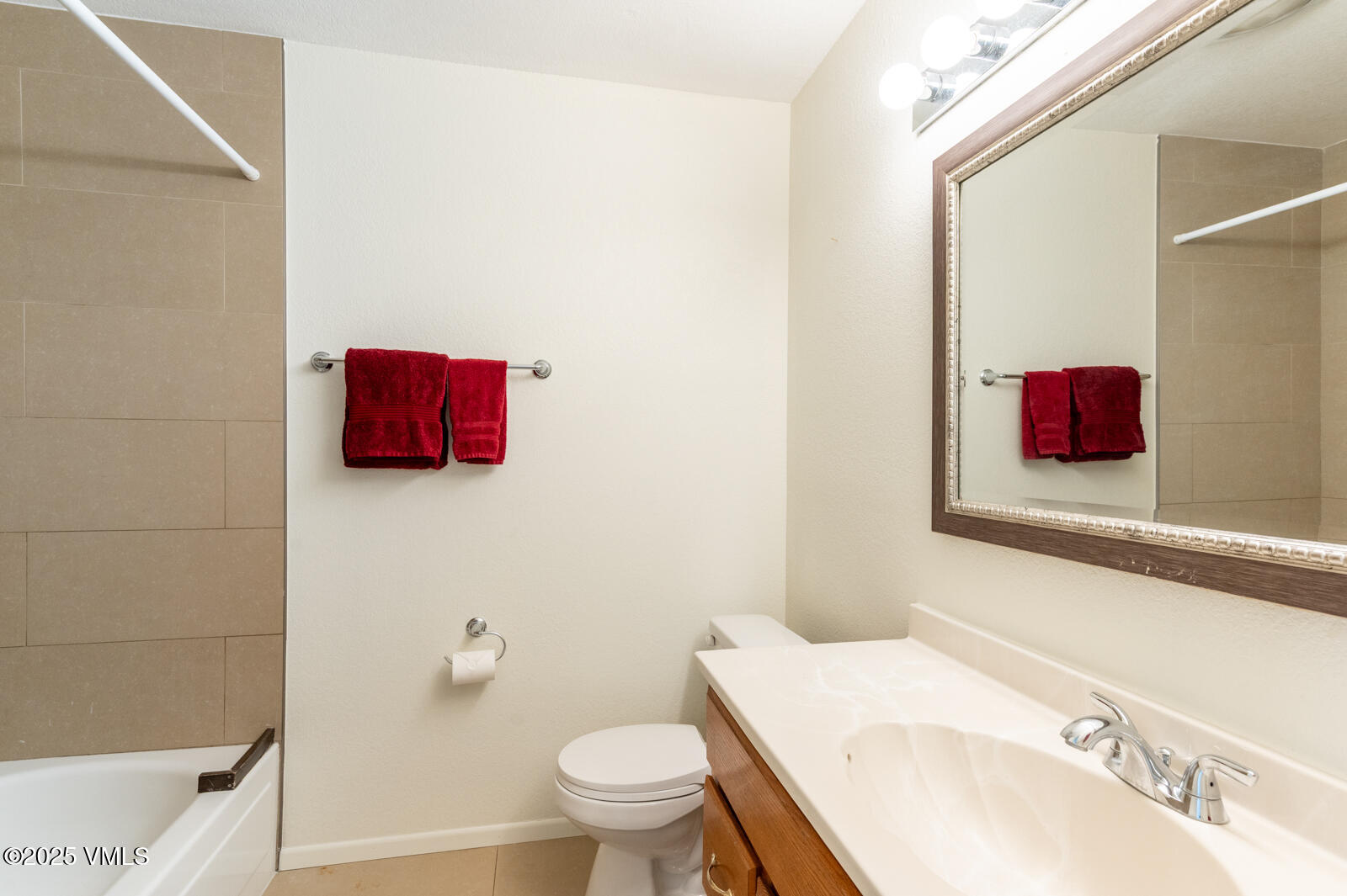 85 Chambers Avenue, Unit 10 Eagle, CO 81631 - Photo 34 of 37 a bathroom with a sink and a mirror